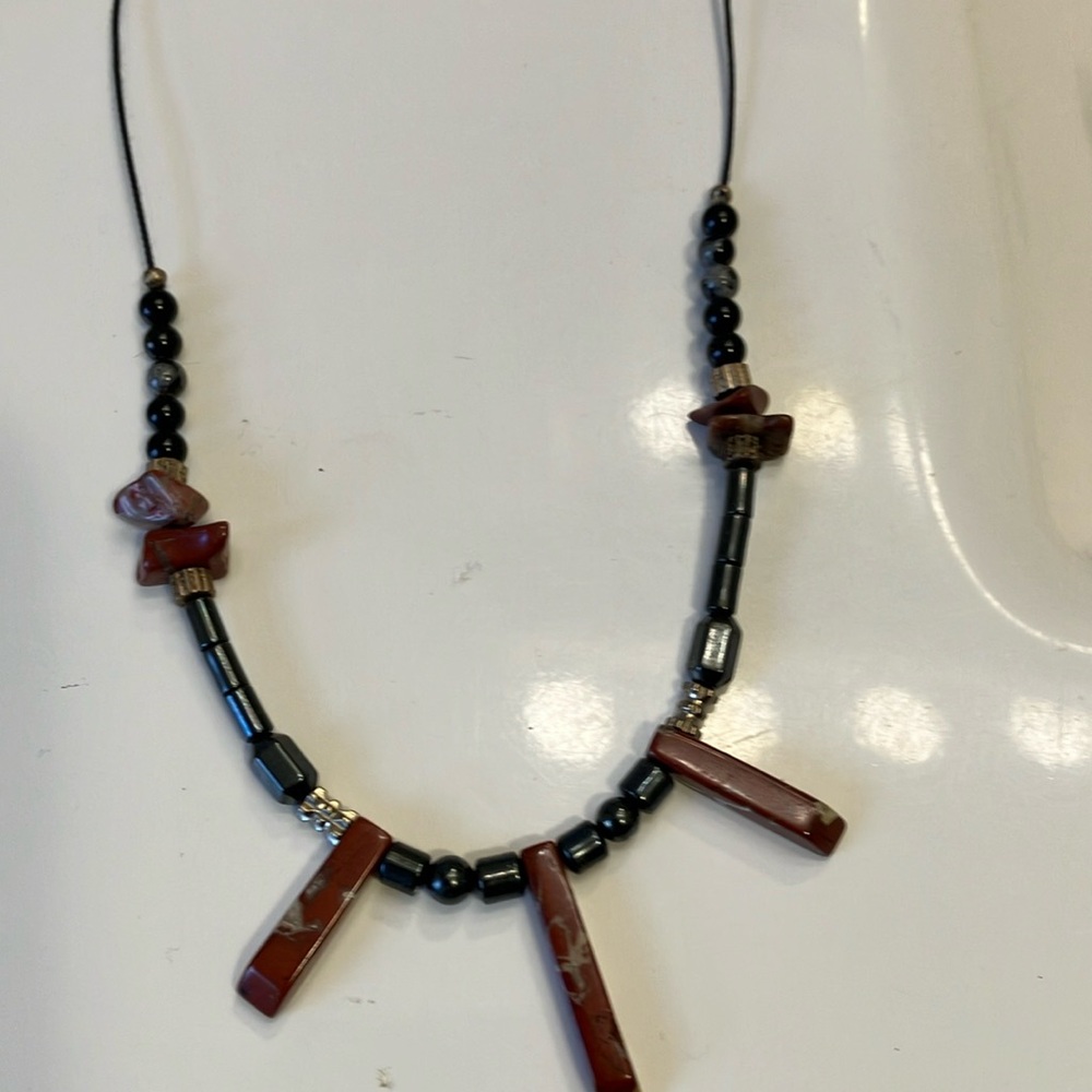 Semi-precious stones with hematite and silver accents make up this necklace.